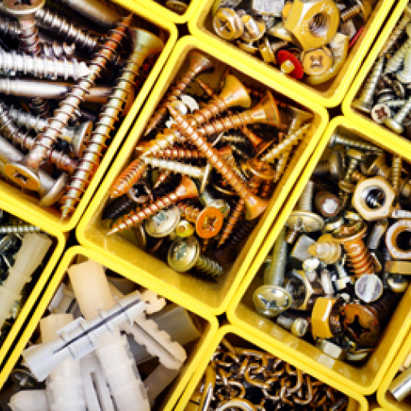 Assorted hardware screws, nuts, and accessories in yellow bins
