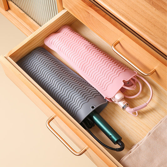 Hot Styling Tool Mats in pink and gray neatly storing hair tools inside a drawer, ideal for portable and organized heat-safe storage.