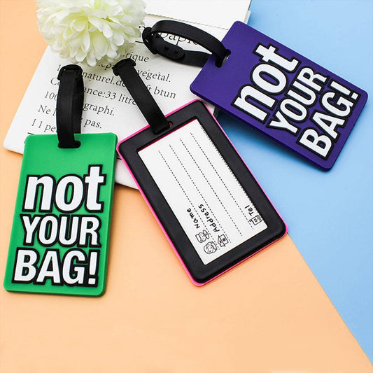 Back view of Travel Luggage Tag 'NOT YOUR BAG' showing ID card slot and strap lock. Perfect travel accessory for secure and stylish luggage tagging.