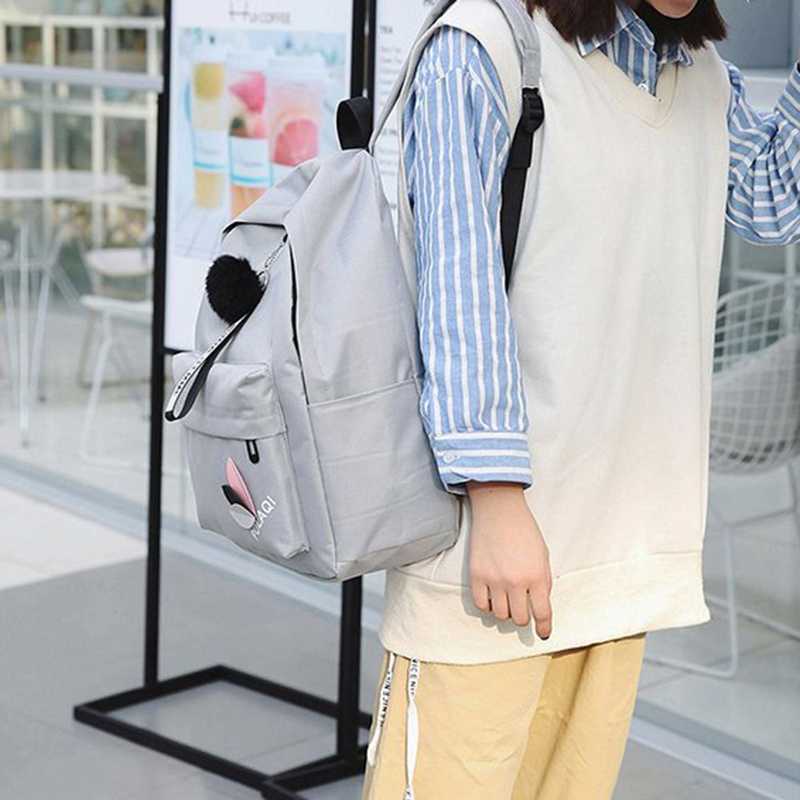 Casual Korean Canvas Backpack in grey worn by a woman, ideal for everyday essentials with a stylish and minimalist design.