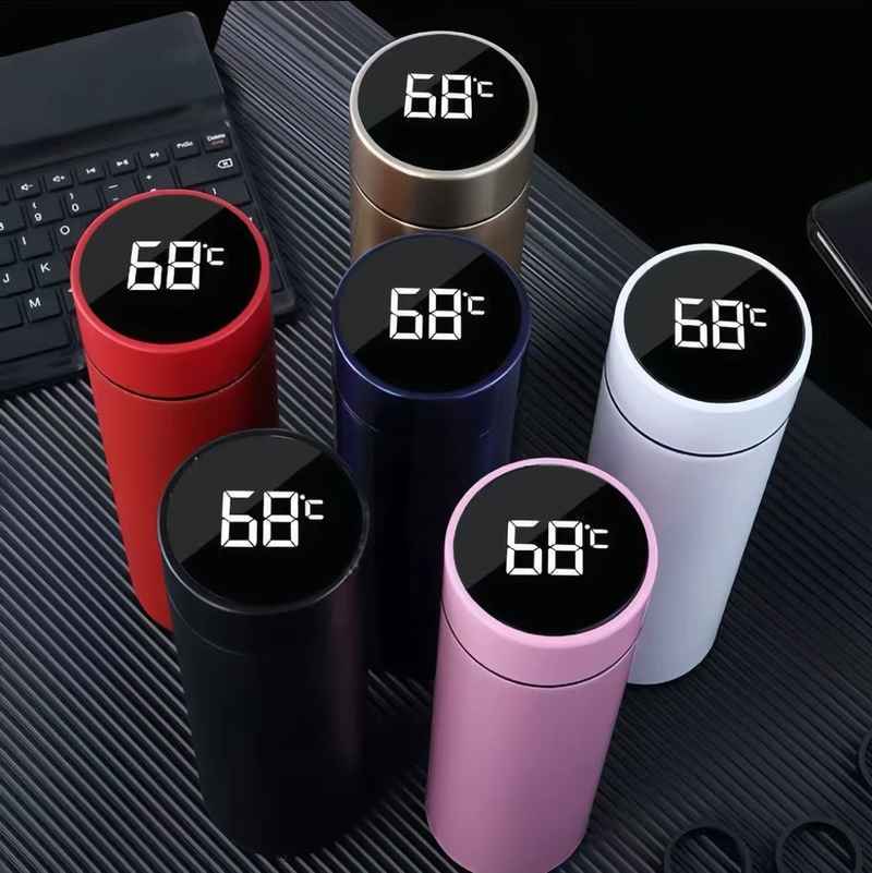 500 ml Smart Insulated Mug with LED temperature display in six colors including red, black, white, pink, gold, and blue. Ideal for hot and cold beverages.
