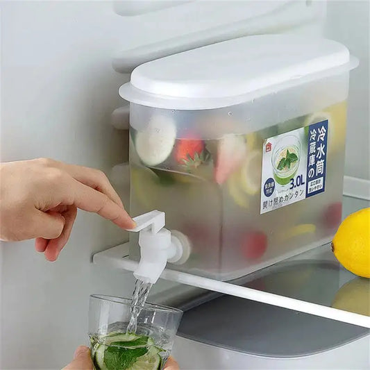3.5L water juice dispenser with spigot in refrigerator, ideal for home use. Transparent container filled with fruit-infused water being poured into glass.
