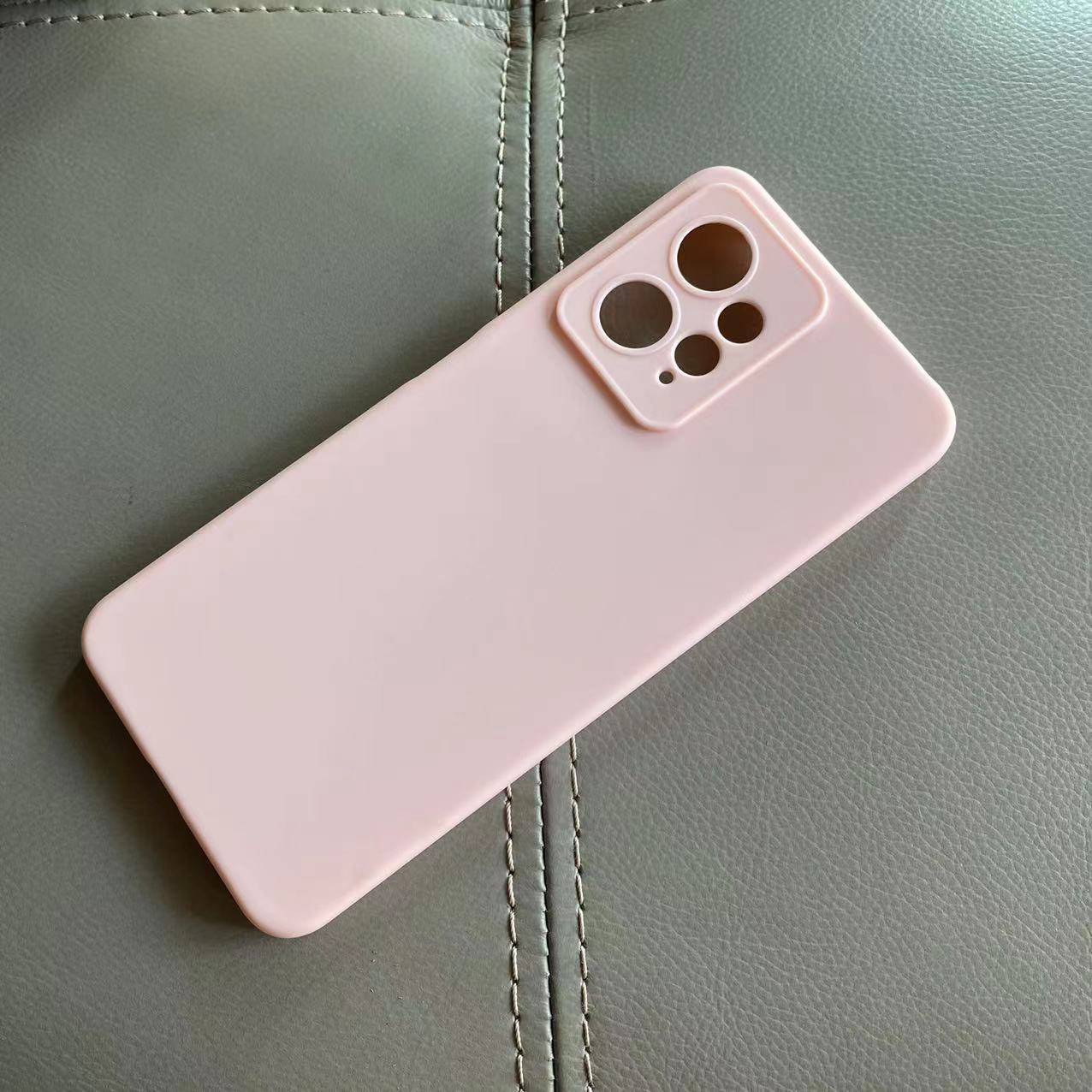 Redmi Note 12 Back Cover in soft pink silicone with precise camera cutouts. Durable protection against scratches and drops for daily use.