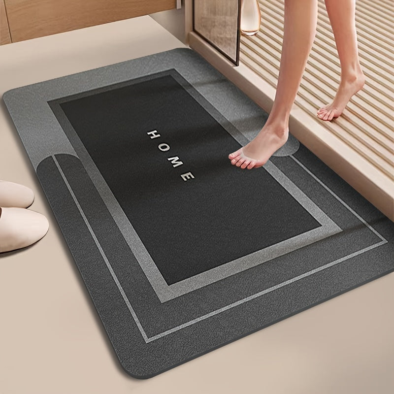 Super Absorbent Home Mat in dark grey with 'HOME' text, placed at a bathroom entrance for anti-skid and water-absorbing use. Ideal bath mat for Sri Lanka homes.