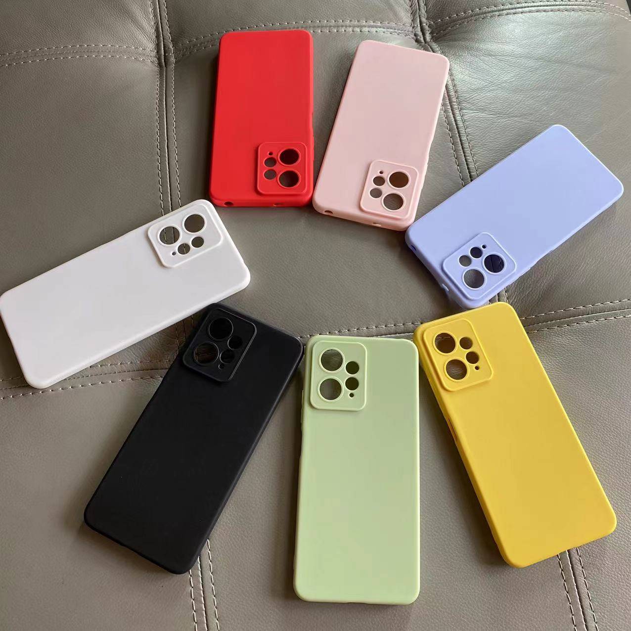 Redmi Note 12 Back Cover in assorted colors including red, pink, blue, white, black, green, and yellow, offering durable scratch and drop protection.