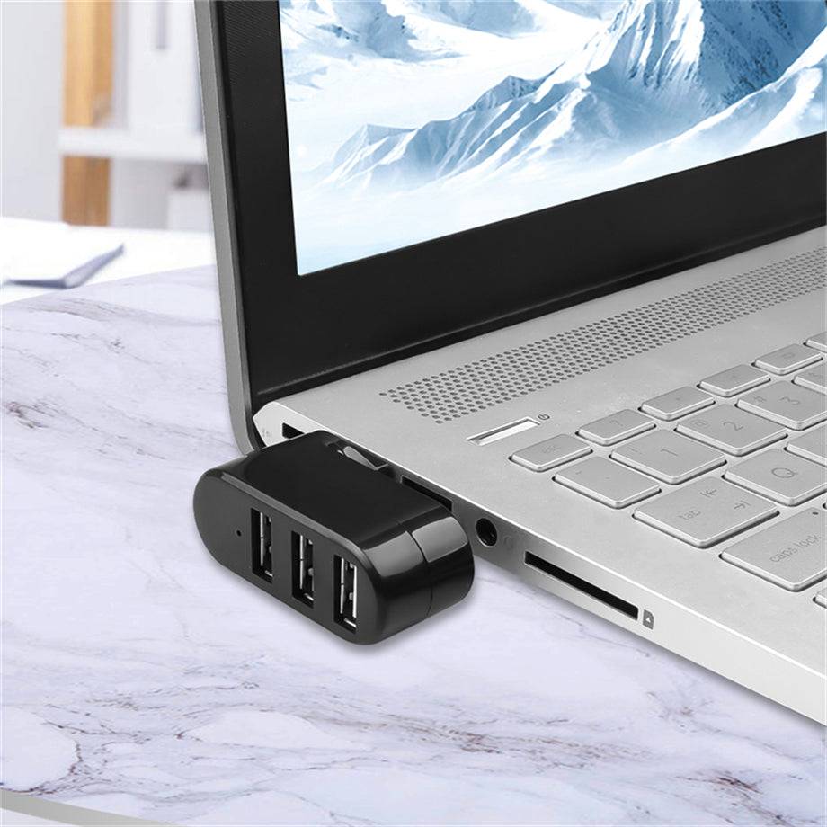 3 Port Rotatable USB Adapter connected to a laptop, showing compact design and multiple USB ports for enhanced device connectivity.