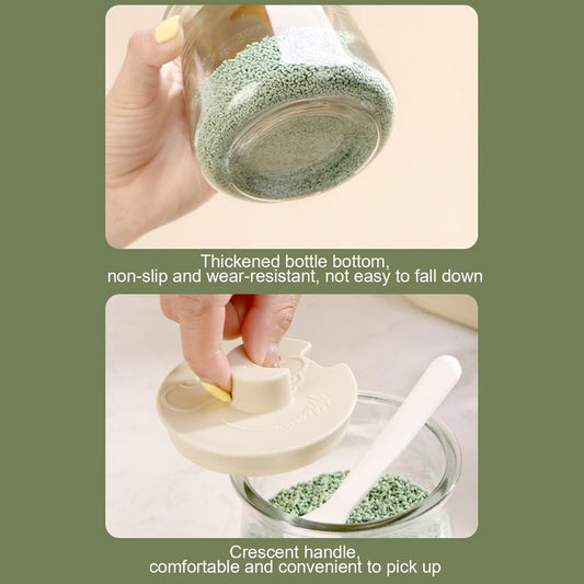 Close-up of thickened glass seasoning bottle base and crescent handle lid, showcasing durability and ergonomic design for kitchen use.