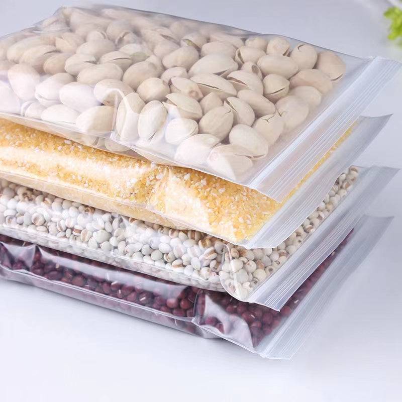 Ziplock Bags 25 Pack - Transparent Seal | 10x12 Inch filled with grains and nuts, showcasing airtight storage for food and pantry use.