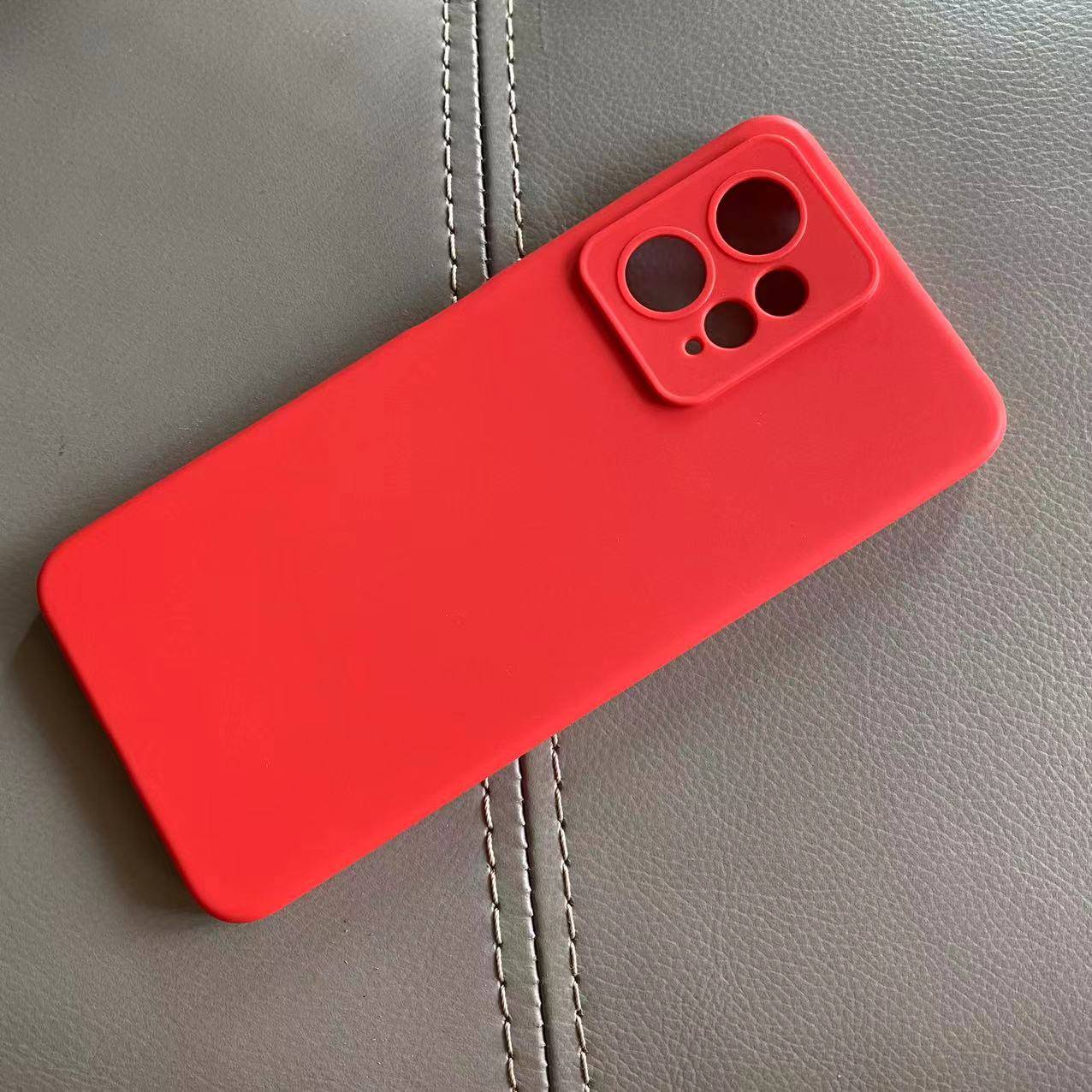 Redmi Note 12 Back Cover in vibrant red with camera cutouts, offering durable protection against scratches and drops for mobile phones.