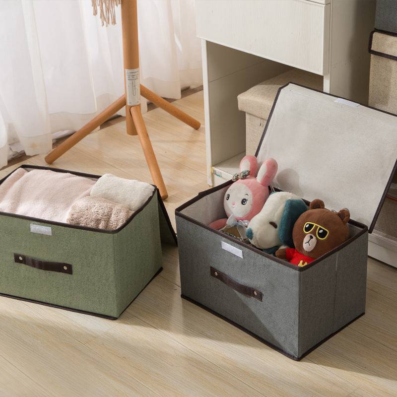 Open foldable storage boxes with lid storing toys and towels, perfect for organizing clothes and household items in closets.