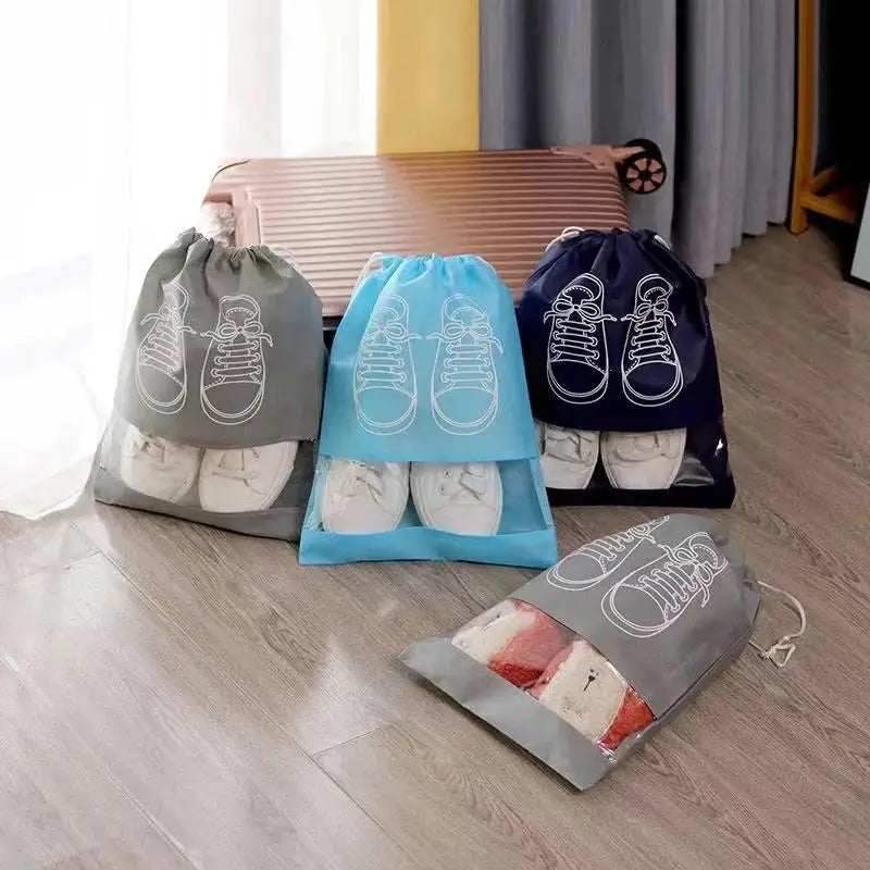 Multi-color shoe storage bags for travel, each holding shoes with clear windows and drawstrings, perfect for organizing multiple pairs.