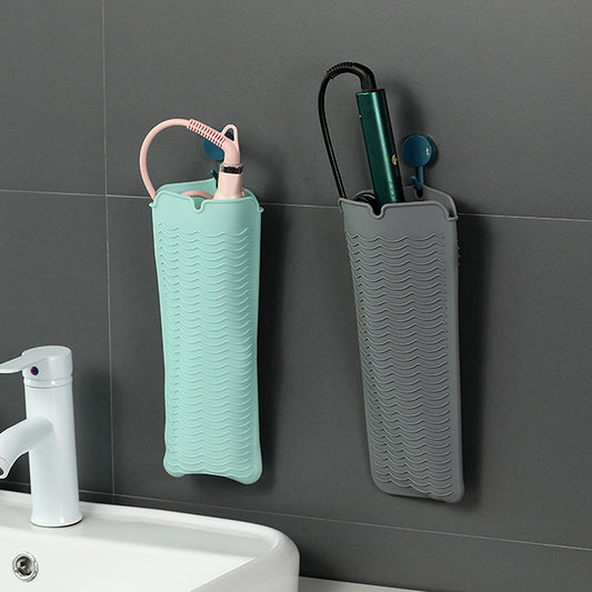 Heat Mat For Hair Straighteners hanging on a bathroom wall, storing hot tools safely with anti-scalding silicone design.