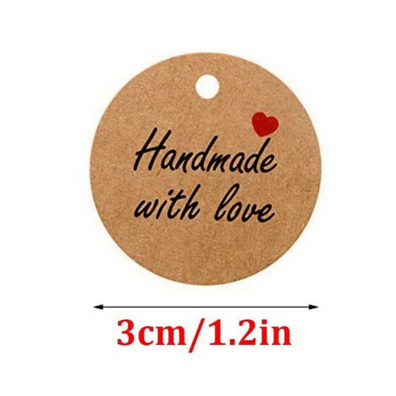 Close-up of a 3cm round kraft paper tag with 'Handmade with Love' text and red heart, part of 100 PCS Handmade Gift Tags for Special Occasions Sri Lanka.