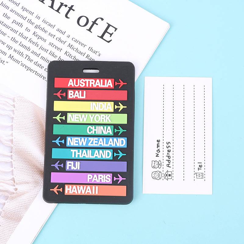 Travel Luggage Tag with multicolor directional arrows pointing to global destinations, includes ID card for personal information.
