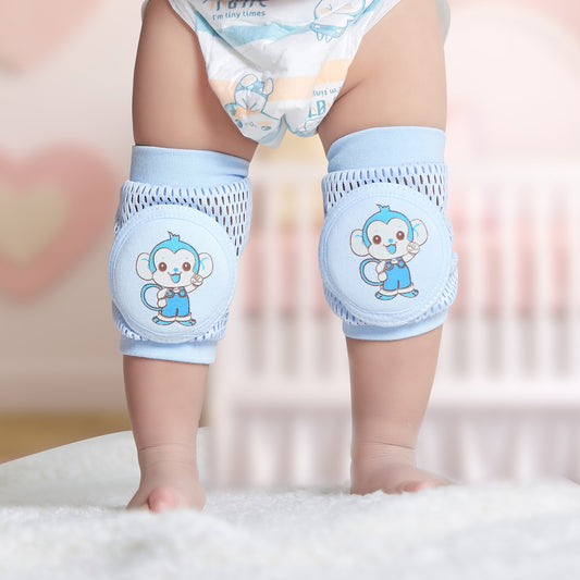 Baby Knee Guard Safety Protector in blue with cartoon monkey design, worn by a baby standing indoors. Shop baby knee guard price in Sri Lanka.