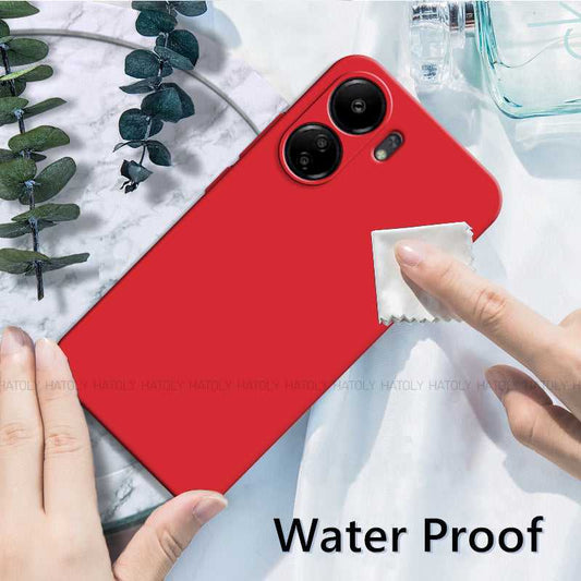 Waterproof Xiaomi Redmi 13C TPU Back Cover in red being cleaned with a cloth, highlighting easy maintenance and durability.