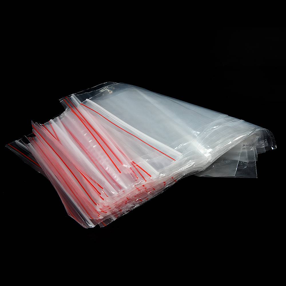 Ziplock Bags 25 Pack - Transparent Seal | 10x12 Inch laid out with red zip seals, perfect for organizing home or kitchen essentials.
