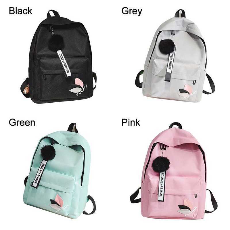 Casual Korean Canvas Backpack available in black, grey, green, and pink, featuring a front pocket and decorative keychain.
