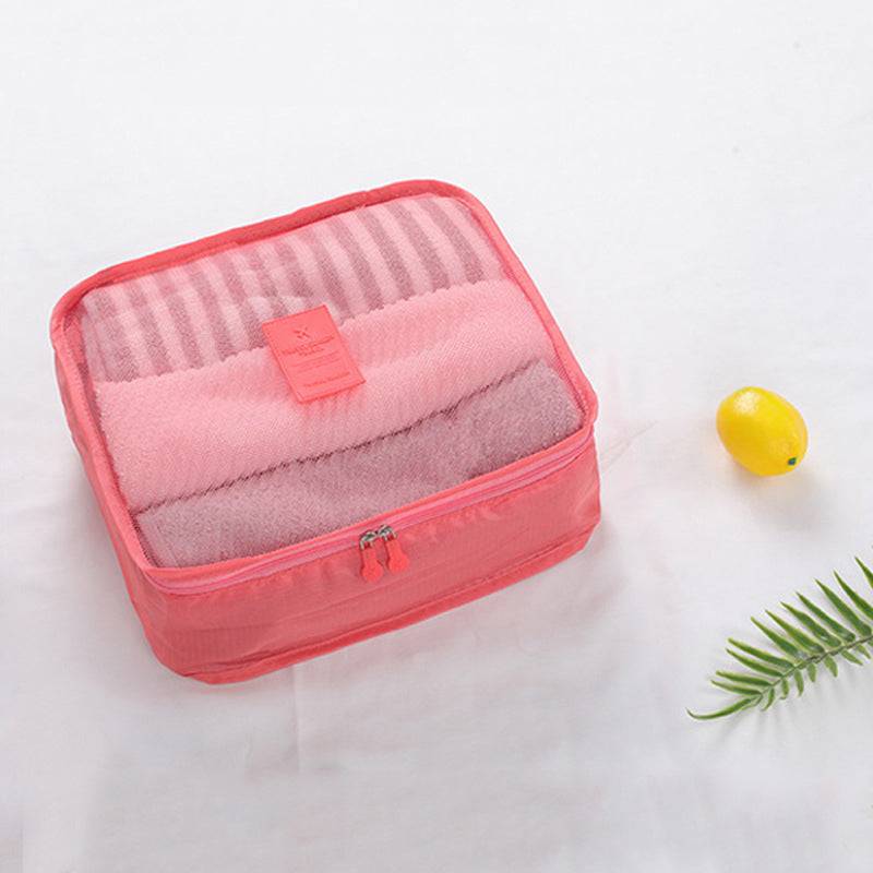 Pink Travel Bag from the 6PCS Storage Bags Set filled with towels, ideal for stylish and organized travel packing.