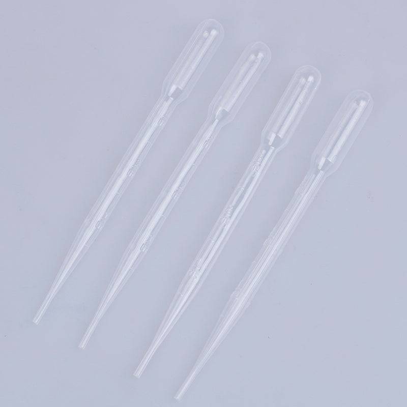 Four transparent 3ml plastic droppers arranged on a white surface, perfect for controlled liquid application in painting kits.