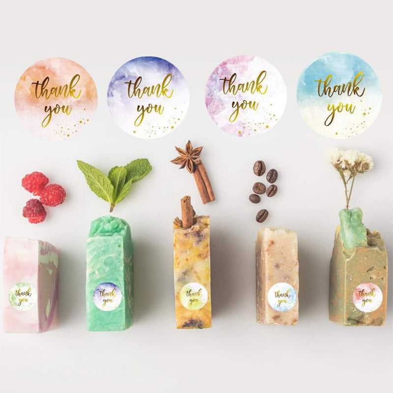 Thank You Stickers 500 Pack - Colorful Matt Finish displayed on handmade soap bars, ideal for arts & crafts or personalized product packaging.