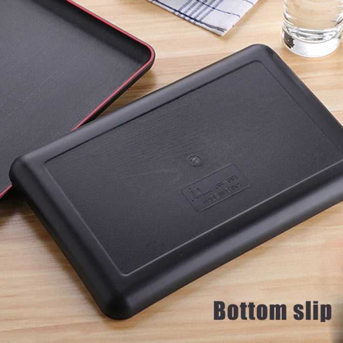 Bottom view of black plastic serving tray showing non-slip texture for stability, perfect for serving food in kitchens and restaurants. Shop online at Bamagate.com.