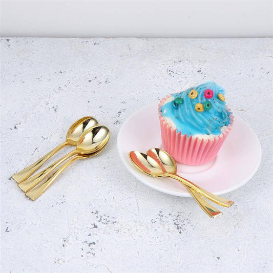 Gold Tea Spoon Set - Gold Tea Spoons | 6 PCs Stainless Steel displayed beside a cupcake on a white plate. Elegant flatware for tea time or dessert.