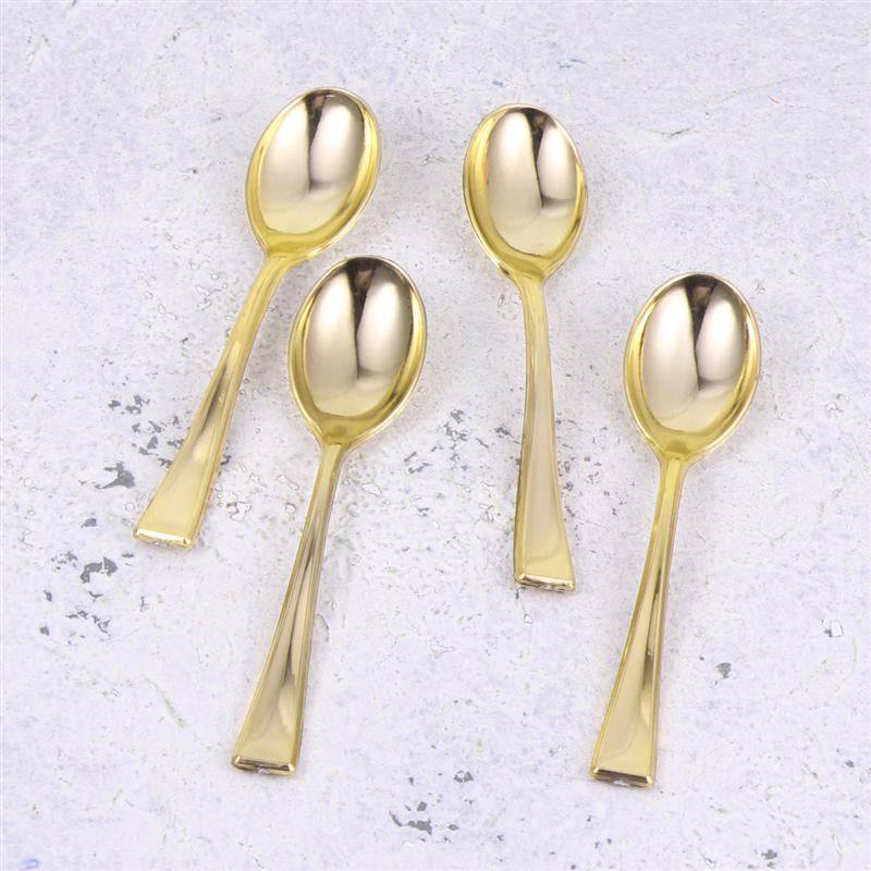 Gold Tea Spoon Set - Gold Tea Spoons | 6 PCs Stainless Steel featuring four elegant gold-finished teaspoons on a light textured surface. Ideal for stylish tea service.