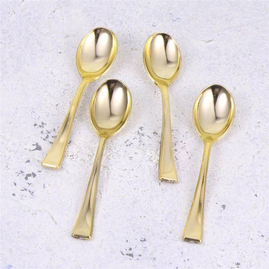 Gold Tea Spoon Set - Gold Tea Spoons | 6 PCs Stainless Steel featuring four elegant gold-finished teaspoons on a light textured surface. Ideal for stylish tea service.