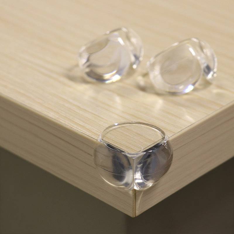 Silicone Table Corner Guard - Protectors | 4PCS, Easy Install shown on wooden table edge. Transparent soft silicone cushions sharp corners for safety.