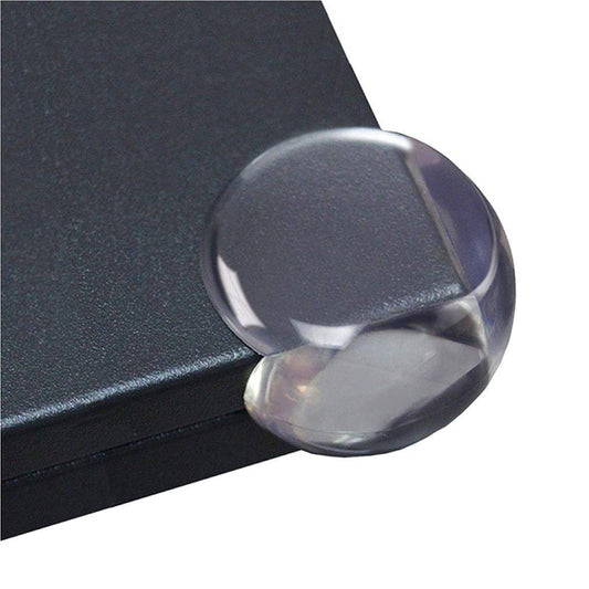Silicone Table Corner Guard 4PCS shown on a black table edge. Transparent protector cushions sharp corners for child safety and easy installation.