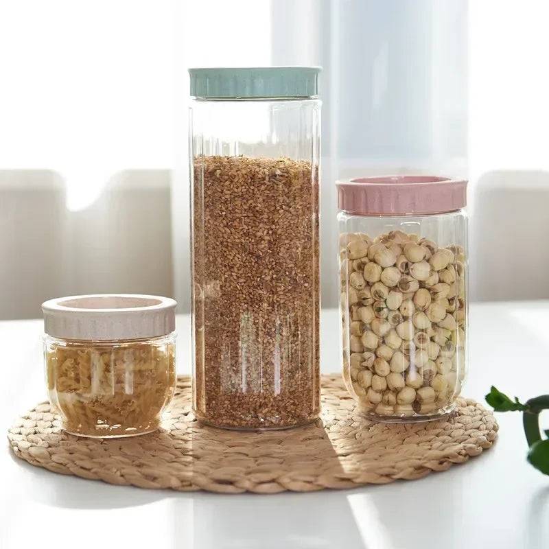 Three Stackable Plastic Storage Bottles with pastel lids displayed on a woven mat, showcasing food storage container options for kitchens.