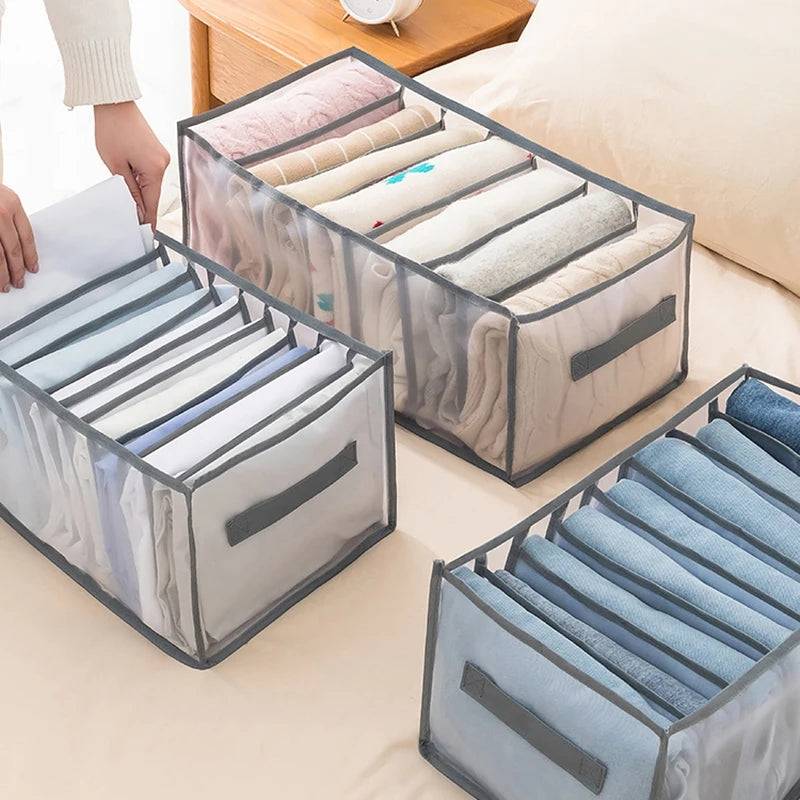 Set of 7-grid drawer storage boxes in gray, organizing clothes like shirts and pants on a bed, perfect for home storage and space saving.