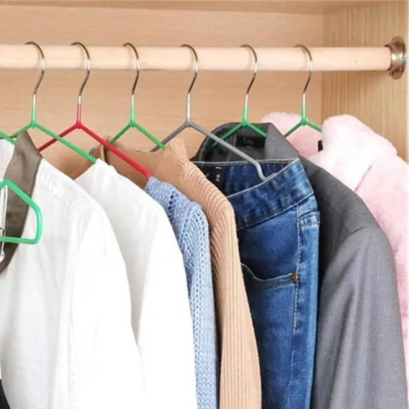 Assorted color Metal PVC Coated Cloth Hangers holding various garments in a wooden wardrobe, perfect for closet organization.