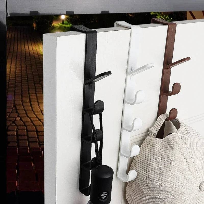 Coat and Hat Hanger - Organizer Solution with multiple hooks in use on a door, holding hats and bags. Space-saving hook hanger in black, white, and brown.