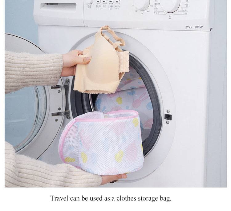Mesh Washing Bag for Safe Underwear Wash shown with bra being placed into front-load washer. Durable zipper and breathable mesh protect delicates.