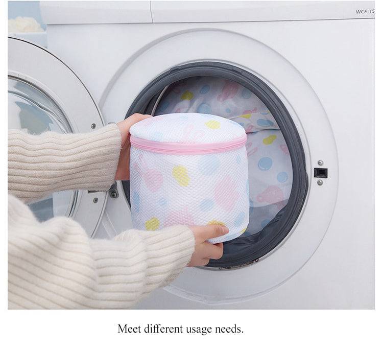 Mesh Washing Bag for Safe Underwear Wash shown being placed into a front-load washing machine. Protects delicate garments with zippered closure.