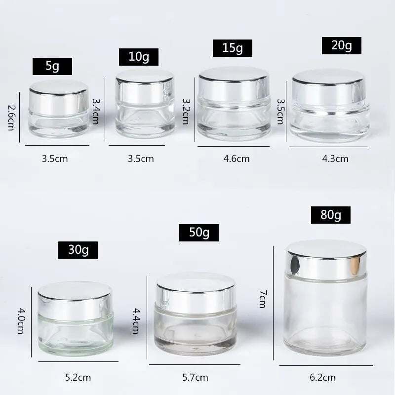 Various sizes of Cosmetic Empty Glass Bottles with silver lids from 5g to 80g, perfect for travel or home use in skincare and cream storage.