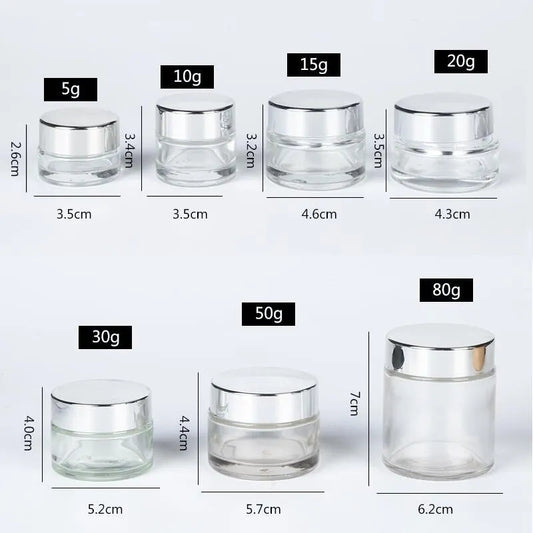Various sizes of Cosmetic Empty Glass Bottles with silver lids from 5g to 80g, perfect for travel or home use in skincare and cream storage.