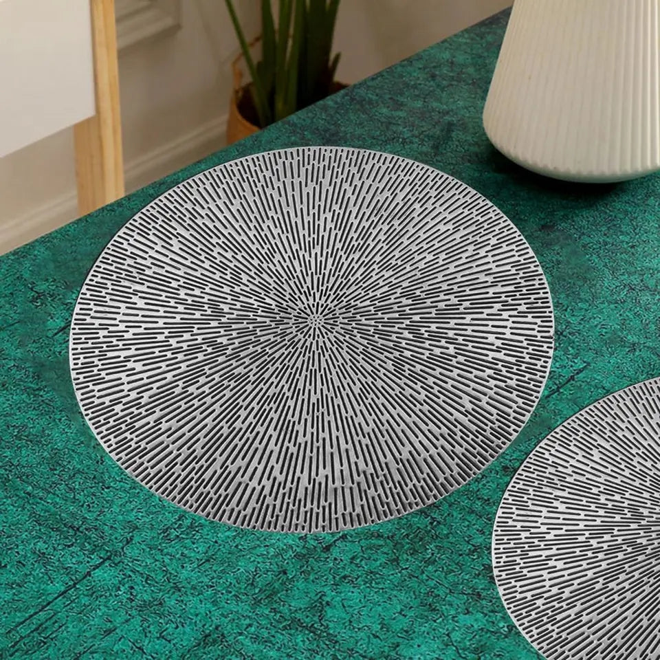 Silver 38 cm PVC table mat with textured design placed on a green marble surface, perfect for contemporary table settings from Bamagate.com