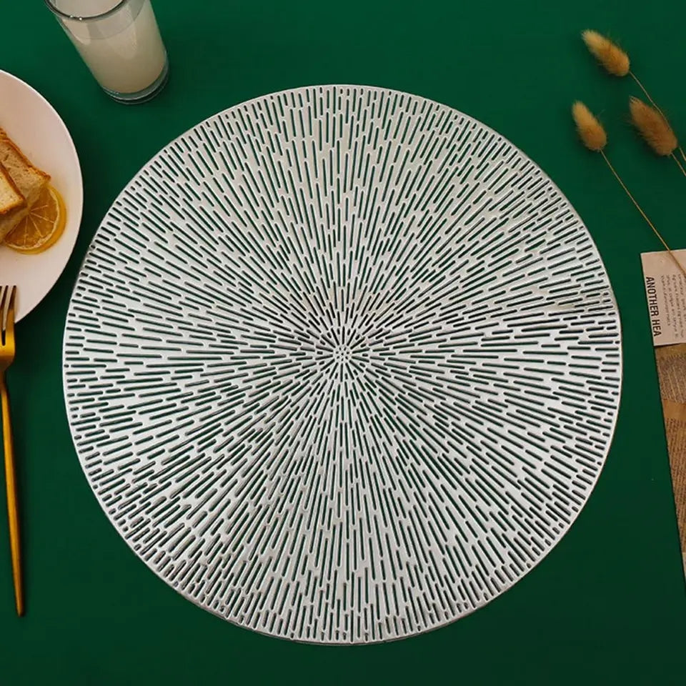 Vinyl round placemat silver 38 cm with a modern geometric pattern on a green table, ideal for stylish kitchen and dining decor at Bamagate.com