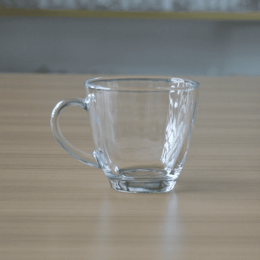 Clear empty glass tea cup from the 6 Cups Glass Tea Set. Durable, heat-resistant drinkware perfect for modern kitchen and dining use.