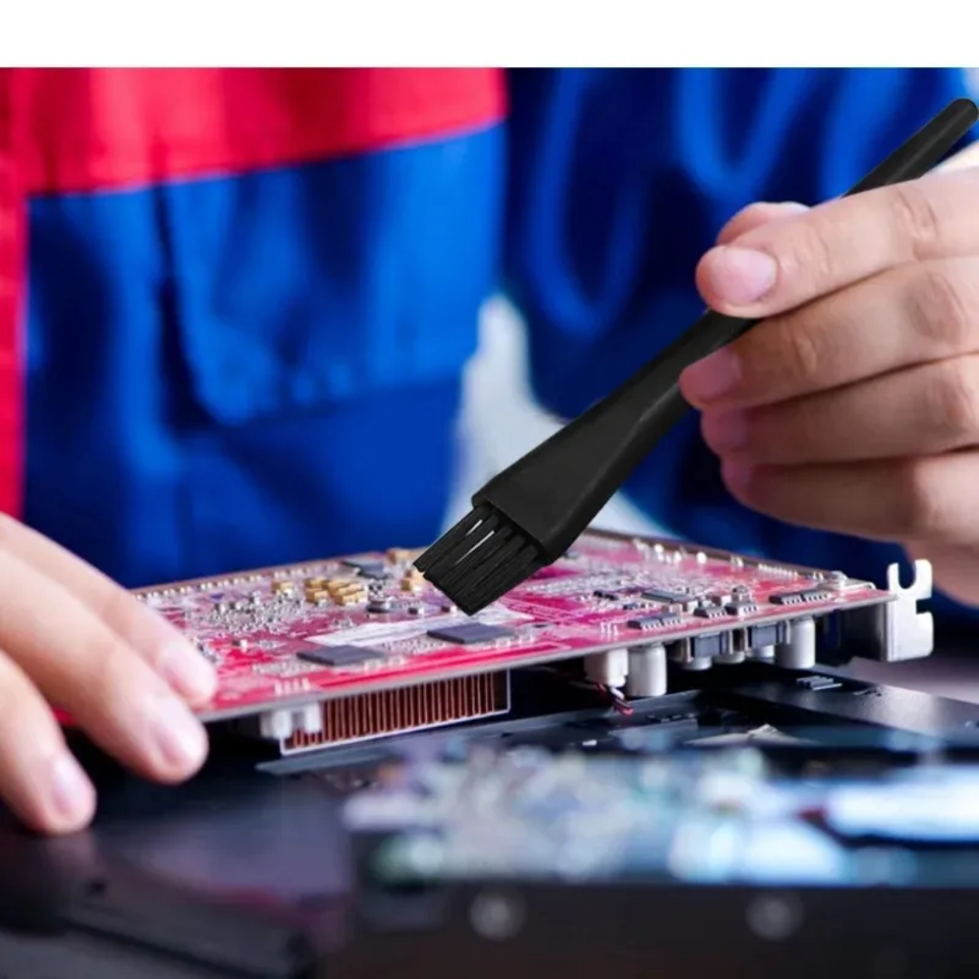 Mini Anti-Static PCB Tool Cleaning Brush used to clean a red printed circuit board, safe for delicate electronic components | Bamagate.com