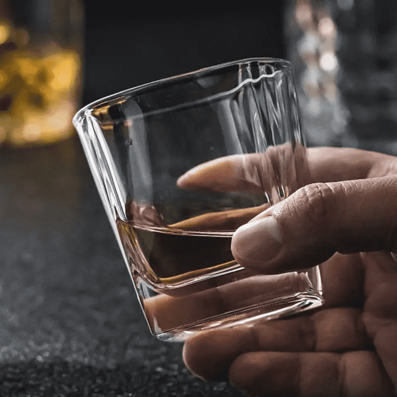 Square Clear Whisky Glass 340 ml held in hand, showcasing its elegant design and clarity for premium whisky tasting.