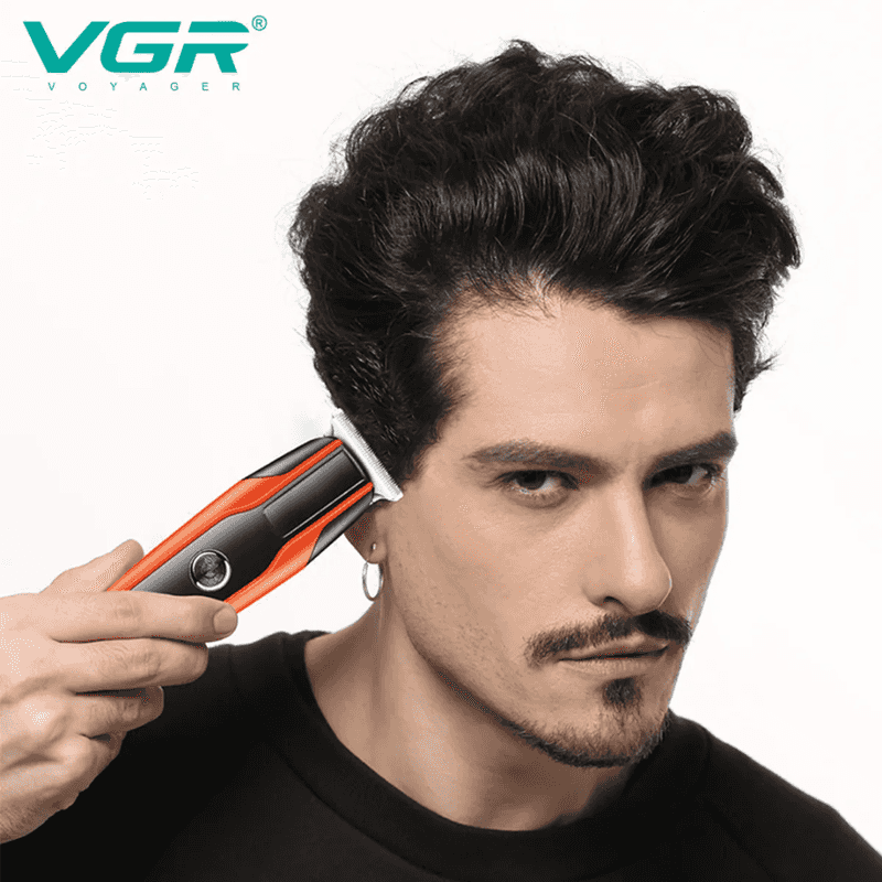 Man using VGR V-999 Professional Rechargeable Cordless Hair Trimmer for precise hair trimming, ideal for home or salon grooming.
