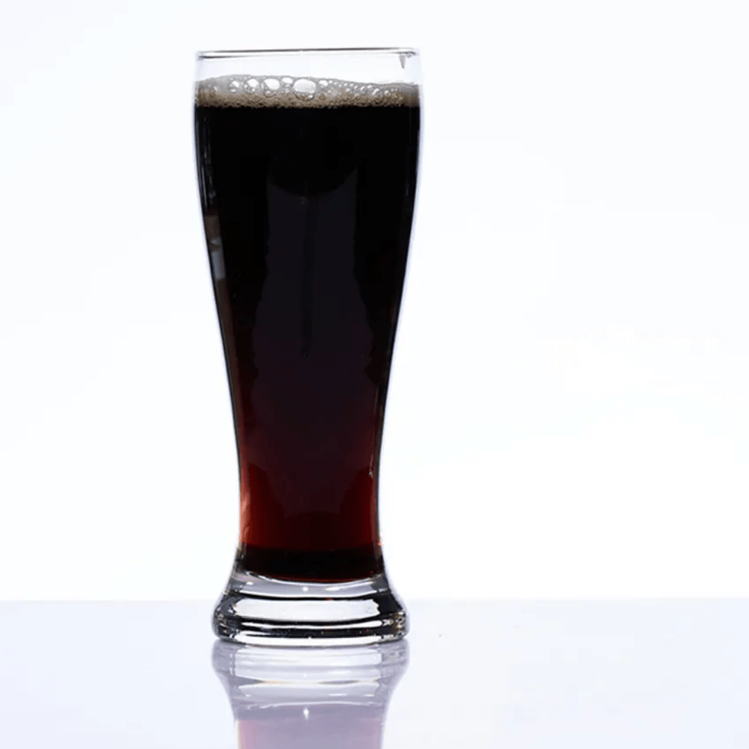 Single 400 ml Mocktail Beer Tumbler Glass with dark stout beer, showcasing the glassware’s versatility for various beverages.