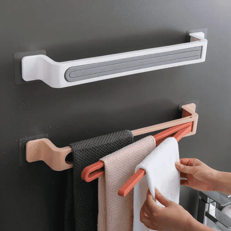 Nail Free Bathroom Towel Holder with dual wall-mounted bars in white and peach, ideal for space-saving and efficient towel organization.