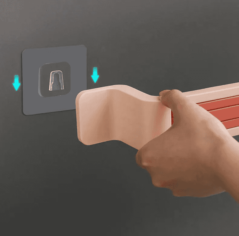 Close-up of Nail Free Bathroom Towel Holder installation showing adhesive wall mount for easy, damage-free setup.