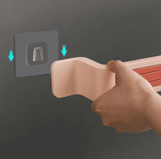 Close-up of Nail Free Bathroom Towel Holder installation showing adhesive wall mount for easy, damage-free setup.