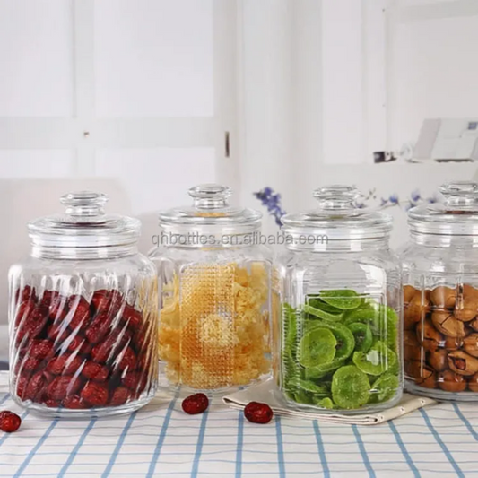 Set of 2L airtight glass jars storing dried fruits and snacks, perfect for preserving freshness in kitchen or pantry with stylish transparent design.